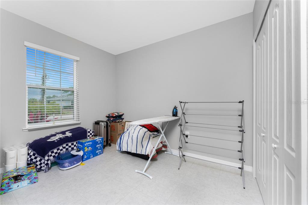 475 Posadas Circle Punta Gorda, FL 33983 - Photo 25 of 54 a bedroom with a bed and a window