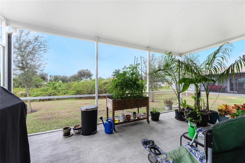 475 Posadas Circle Punta Gorda, FL 33983 - Photo 35 of 54 a view of a patio with plants and a table and chairs