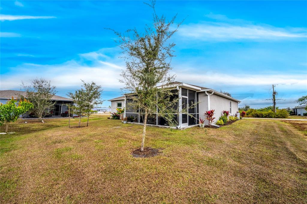 475 Posadas Circle Punta Gorda, FL 33983 - Photo 38 of 54 a view of a house with a yard and garage