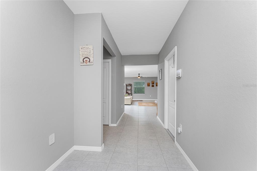 475 Posadas Circle Punta Gorda, FL 33983 - Photo 5 of 54 a view of a hallway with wooden floor