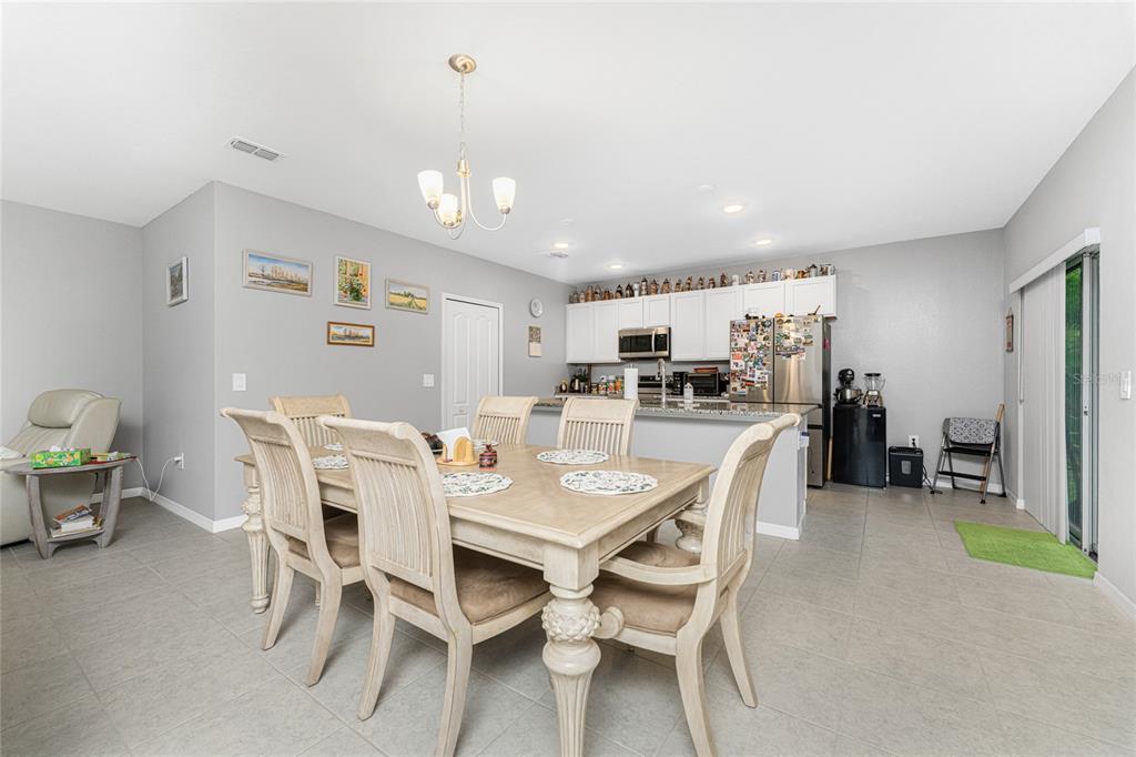 475 Posadas Circle Punta Gorda, FL 33983 - Photo 10 of 54 a view of a dining room with furniture and a kitchen