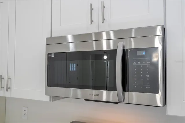 a view of room with window and hardwood