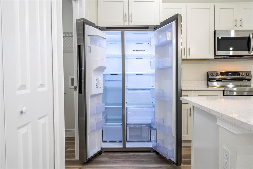 3998 Southwest 157th Place Road Ocala, FL 34473 - Photo 25 of 88 a kitchen with stainless steel appliances cabinets and a counter top space