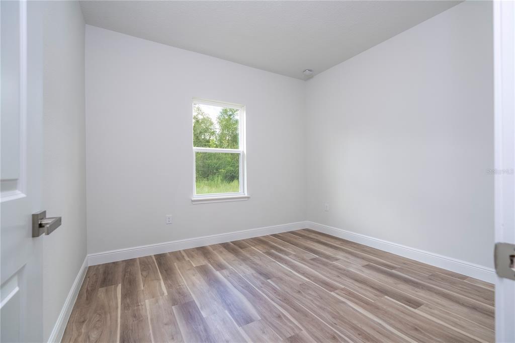 3998 Southwest 157th Place Road Ocala, FL 34473 - Photo 40 of 88 a view of room with window and hardwood