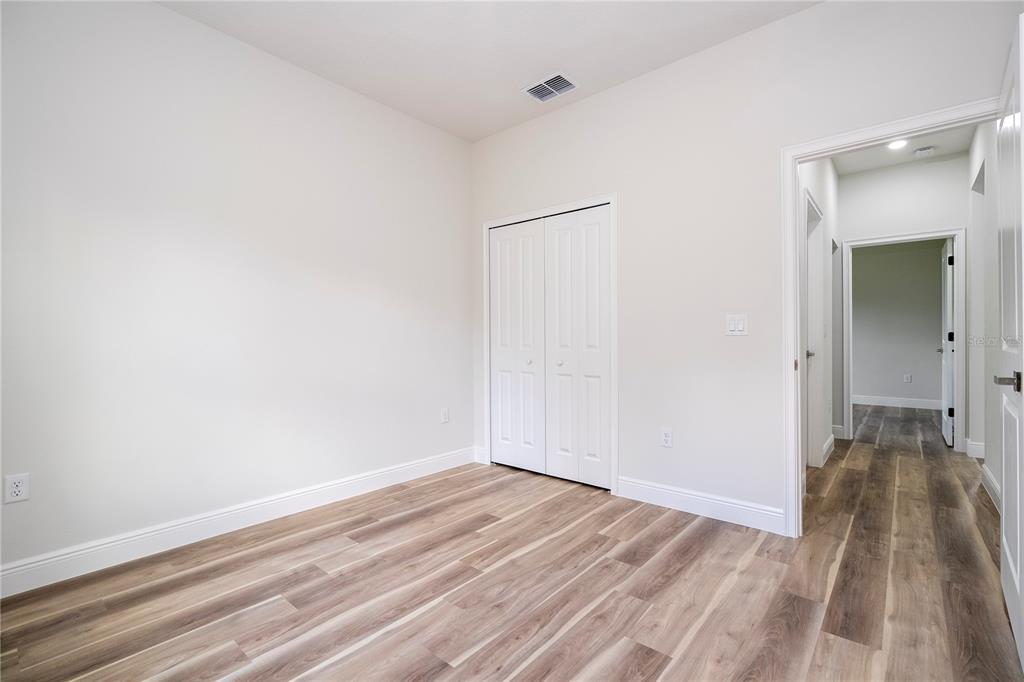 3998 Southwest 157th Place Road Ocala, FL 34473 - Photo 41 of 88 a view of a room with wooden floor and a bathroom