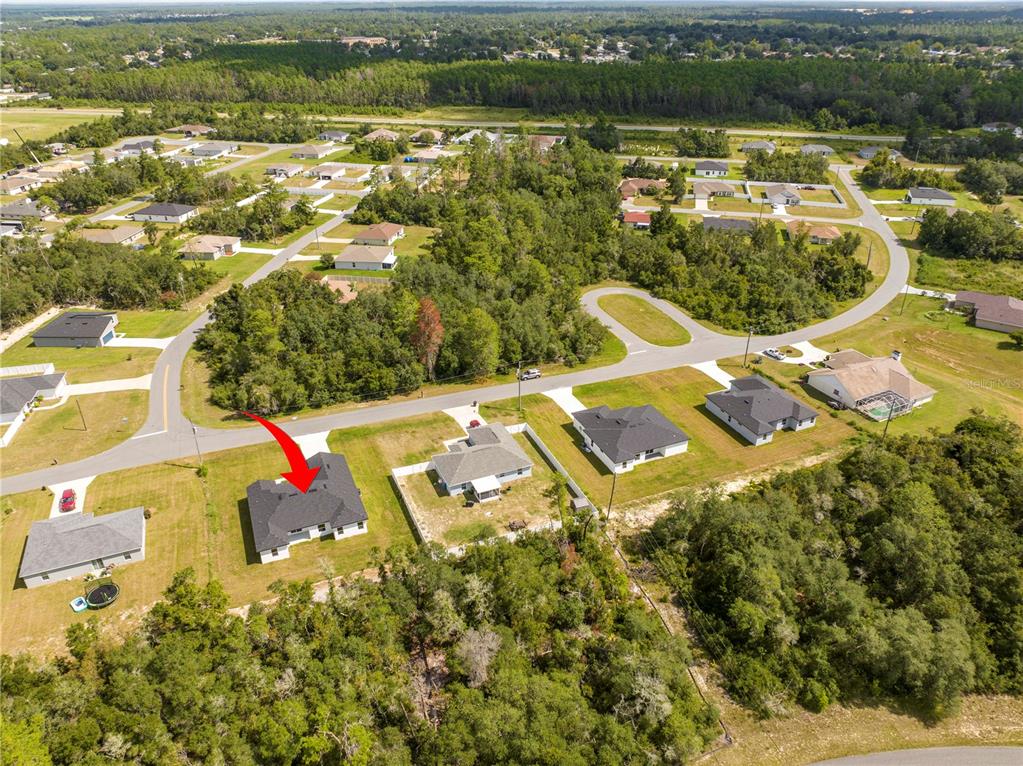 3998 Southwest 157th Place Road Ocala, FL 34473 - Photo 79 of 88 an aerial view of a house with a lake view