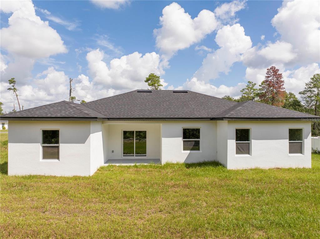3998 Southwest 157th Place Road Ocala, FL 34473 - Photo 82 of 88 a view of a house with a backyard