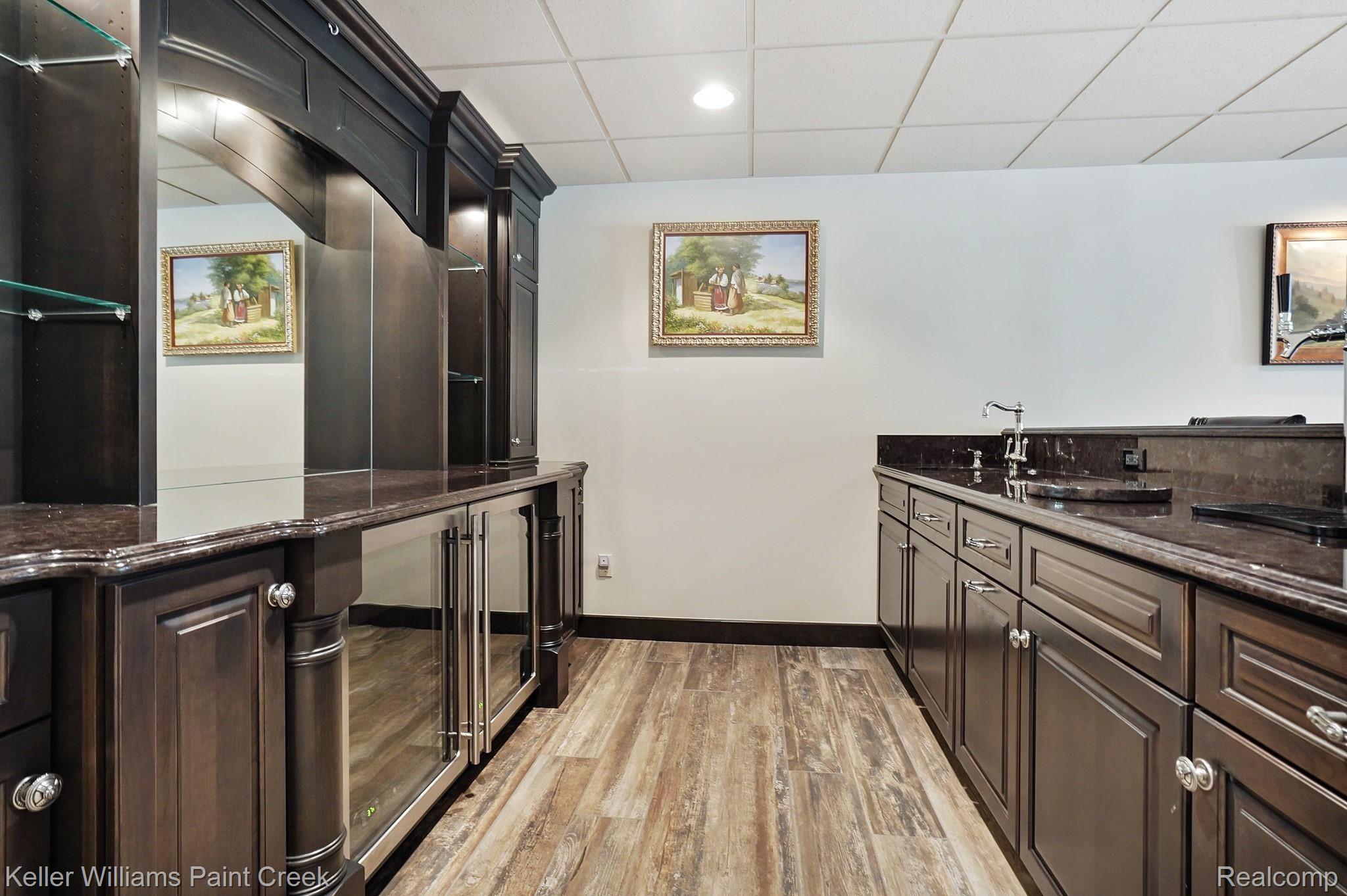 2772 North Addison Circle Rochester, MI 48306 - Photo 62 of 71 Completely custom Bar with two keg tap system, paneled Dishwasher, & dual beverage centers