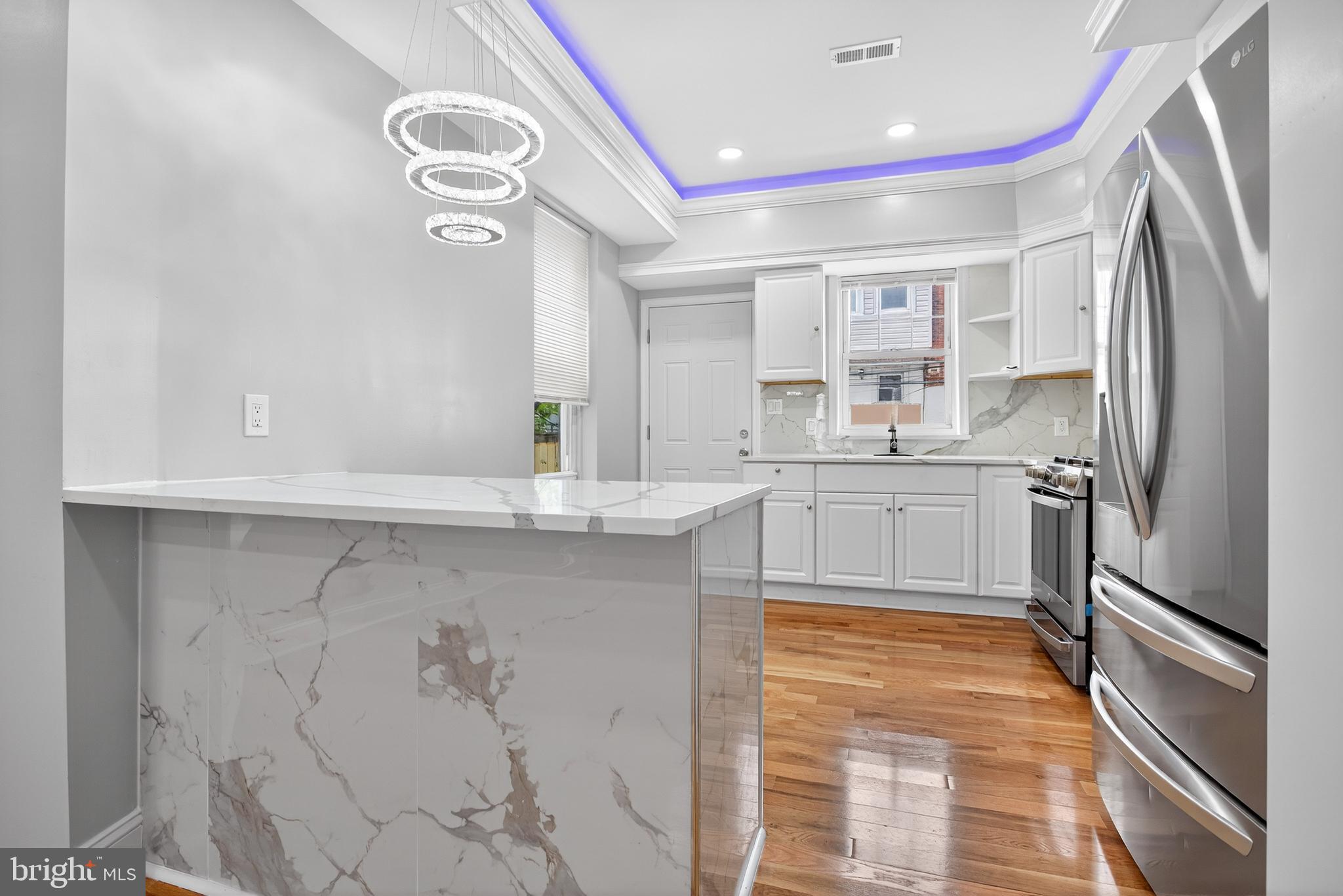 6351 Reedland Street Philadelphia, PA 19142 - Photo 11 of 30 a kitchen with a sink stainless steel appliances and cabinets