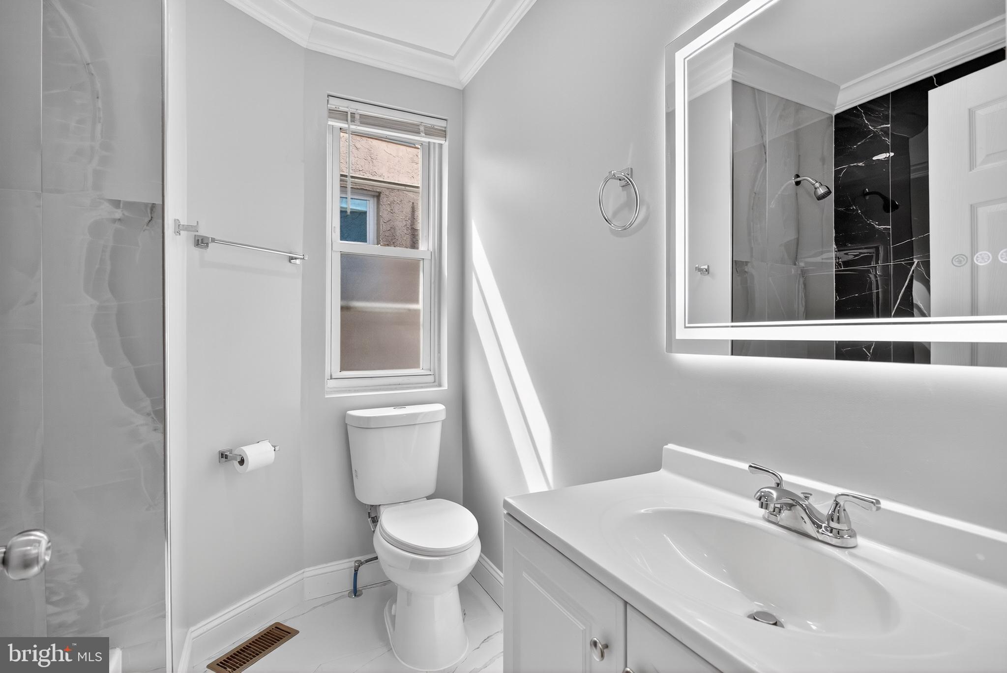 6351 Reedland Street Philadelphia, PA 19142 - Photo 18 of 30 a bathroom with a sink a toilet and shower