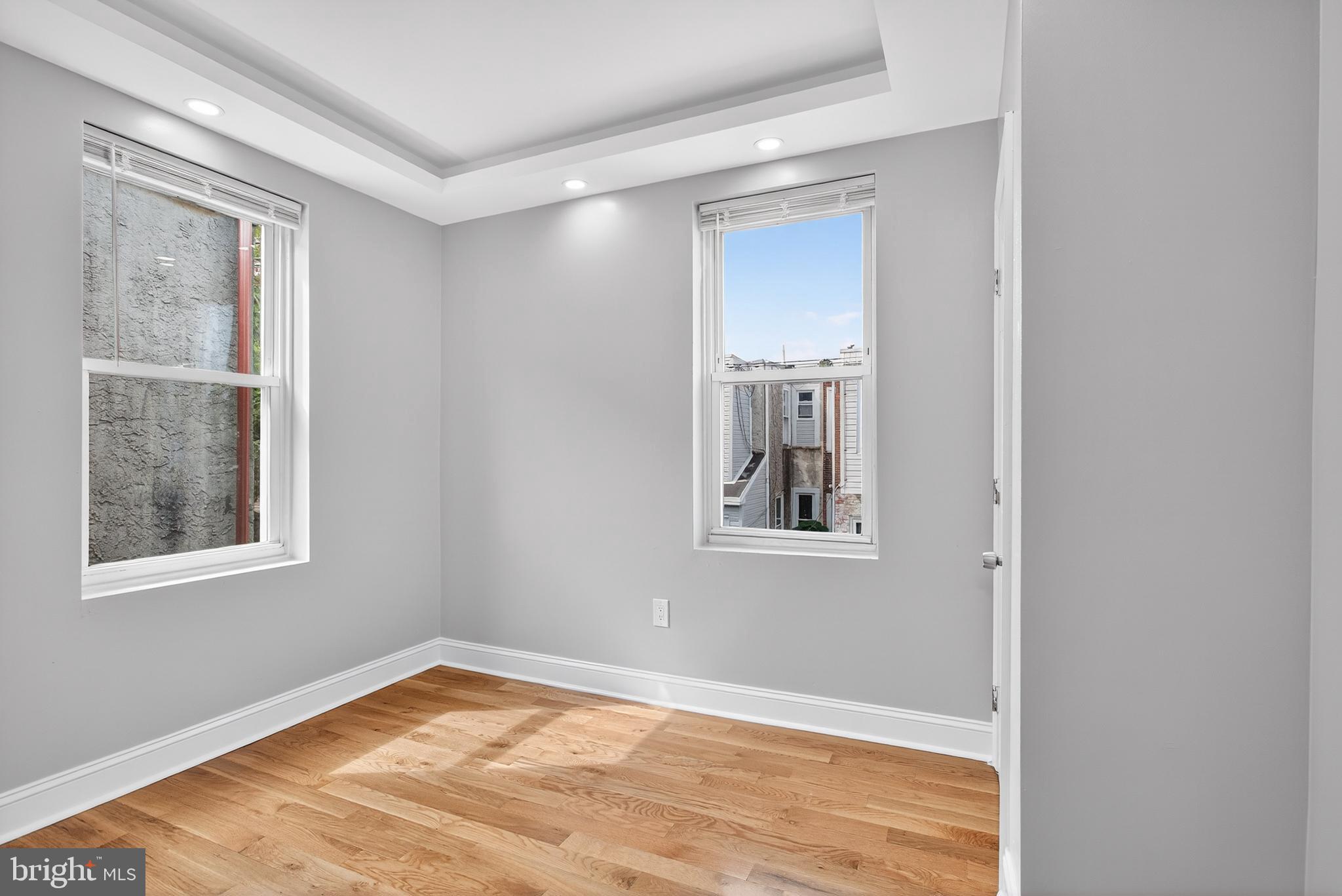 6351 Reedland Street Philadelphia, PA 19142 - Photo 21 of 30 a view of an empty room with wooden floor and a window