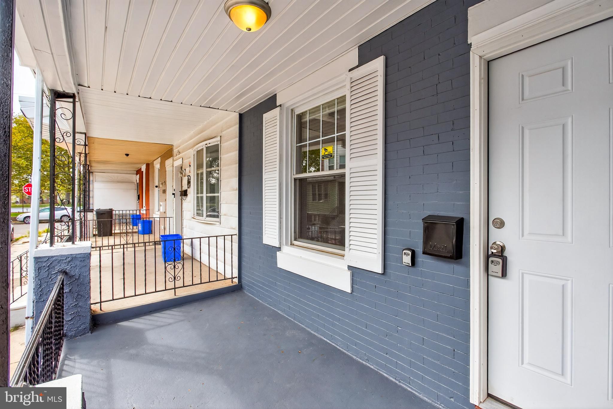 6351 Reedland Street Philadelphia, PA 19142 - Photo 5 of 30 a view of a hallway with wooden floor and windows in a room