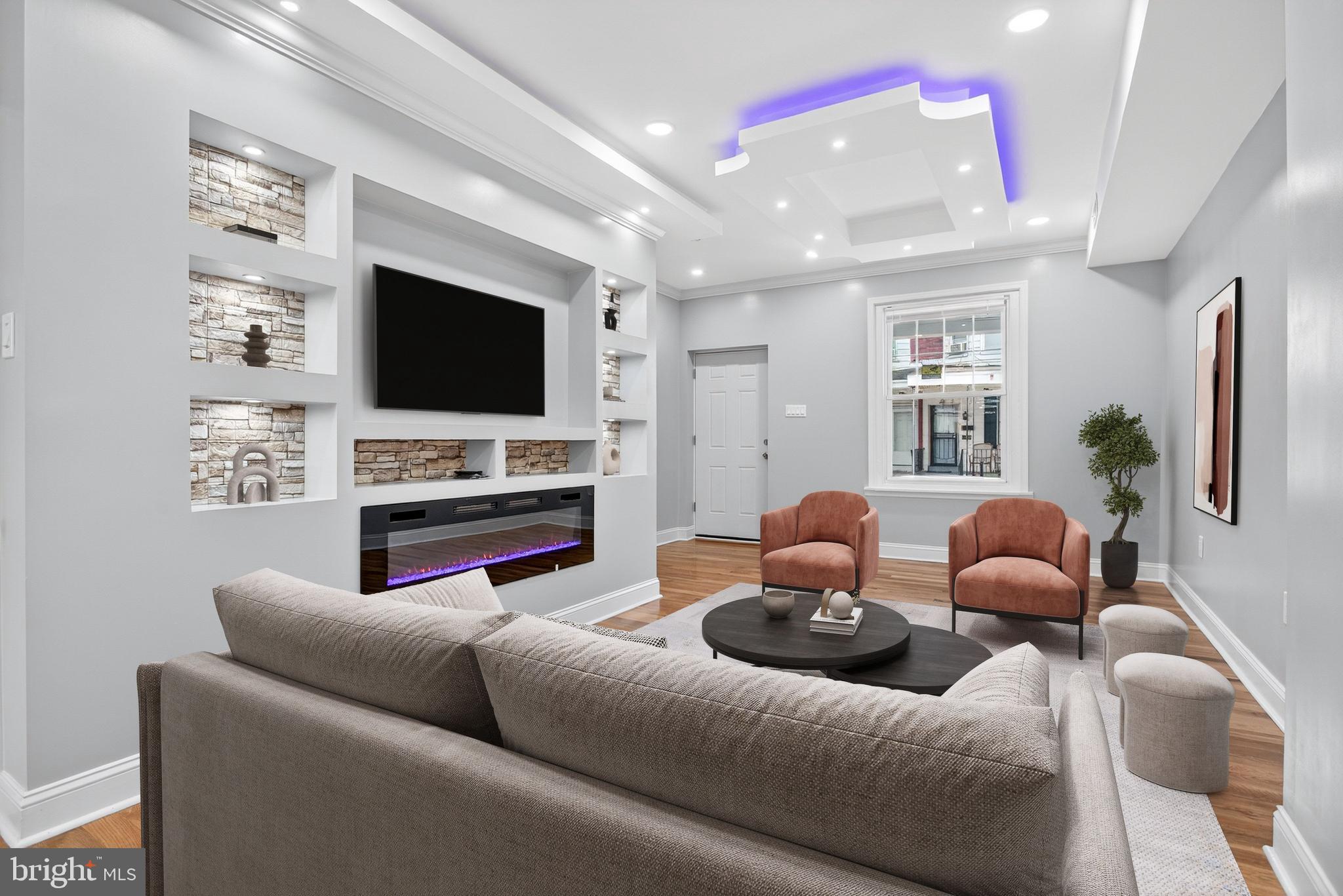 6351 Reedland Street Philadelphia, PA 19142 - Photo 7 of 30 a living room with furniture and a flat screen tv