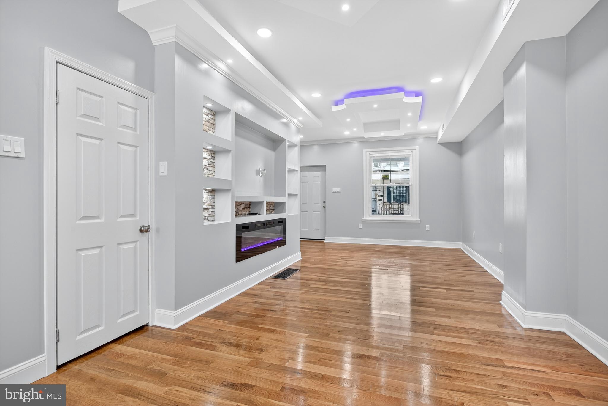 6351 Reedland Street Philadelphia, PA 19142 - Photo 9 of 30 a view of an empty room with window and wooden floor