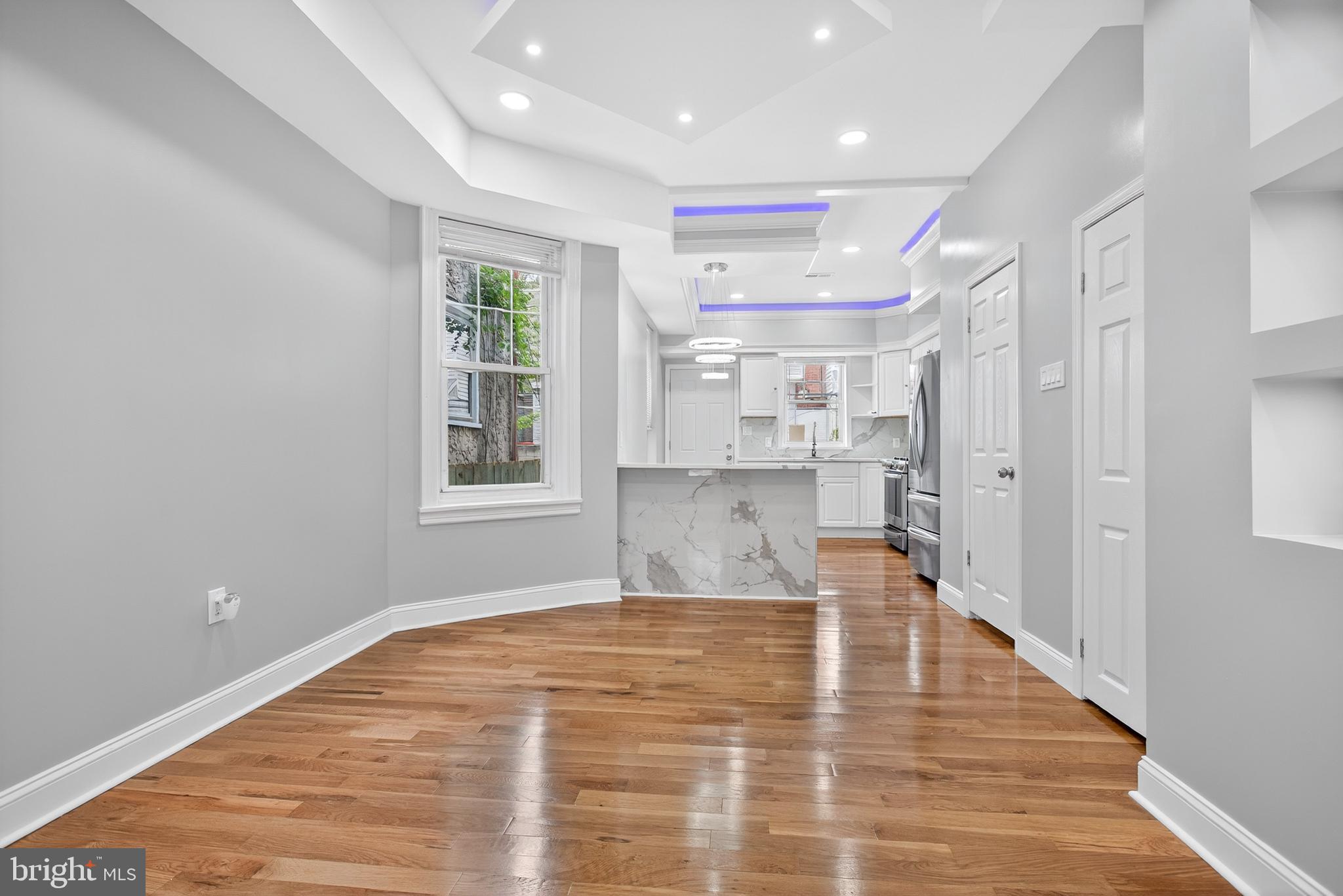 6351 Reedland Street Philadelphia, PA 19142 - Photo 10 of 30 a view of kitchen and hall with wooden floor