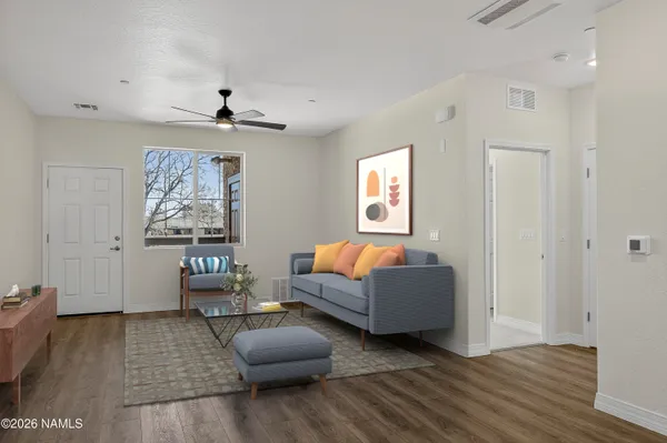 a living room with furniture and a window