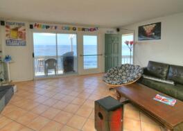 Undisclosed Address Isla Vista, CA 93117 - Photo 6 of 16 a living room with furniture and a floor to ceiling window