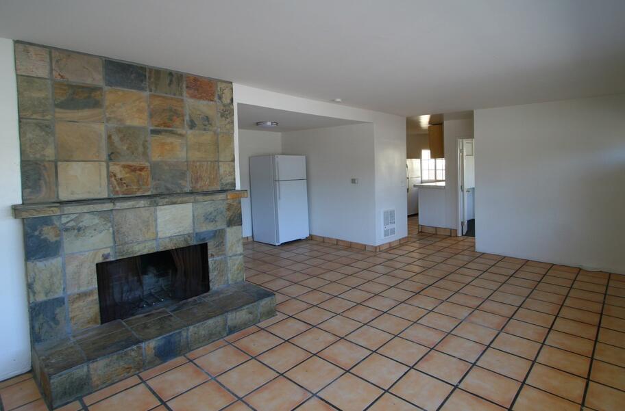 Undisclosed Address Isla Vista, CA 93117 - Photo 9 of 16 a bedroom with a bed and a fireplace