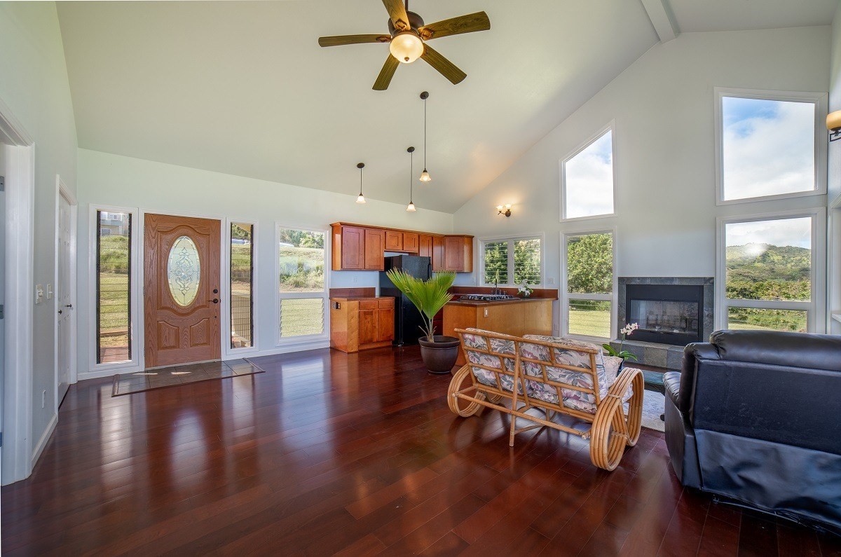 5495 A Puulima Road, Unit D Kalaheo, HI 96741 - Photo 5 of 24 a living room with furniture and a wooden floor
