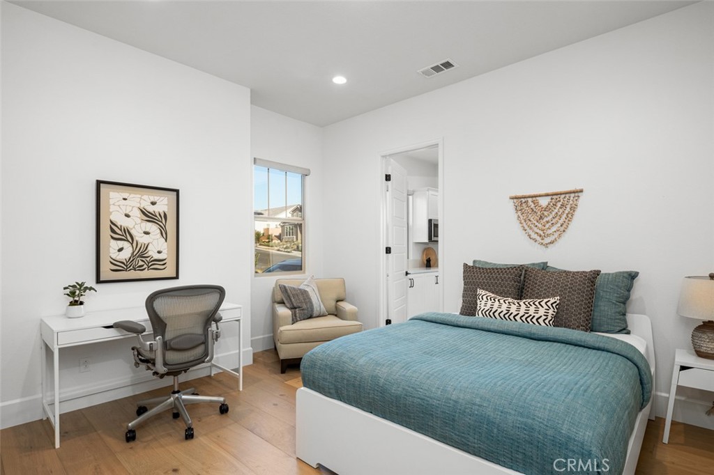 39504 Caladium Drive Temecula, CA 92591 - Photo 17 of 38 a bedroom with a bed and a chair