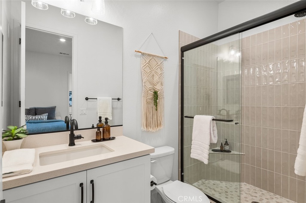 39504 Caladium Drive Temecula, CA 92591 - Photo 19 of 38 a bathroom with a sink a toilet and shower