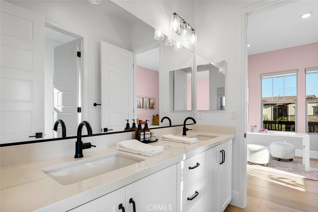 39504 Caladium Drive Temecula, CA 92591 - Photo 22 of 38 a bathroom with a sink double vanity and a mirror
