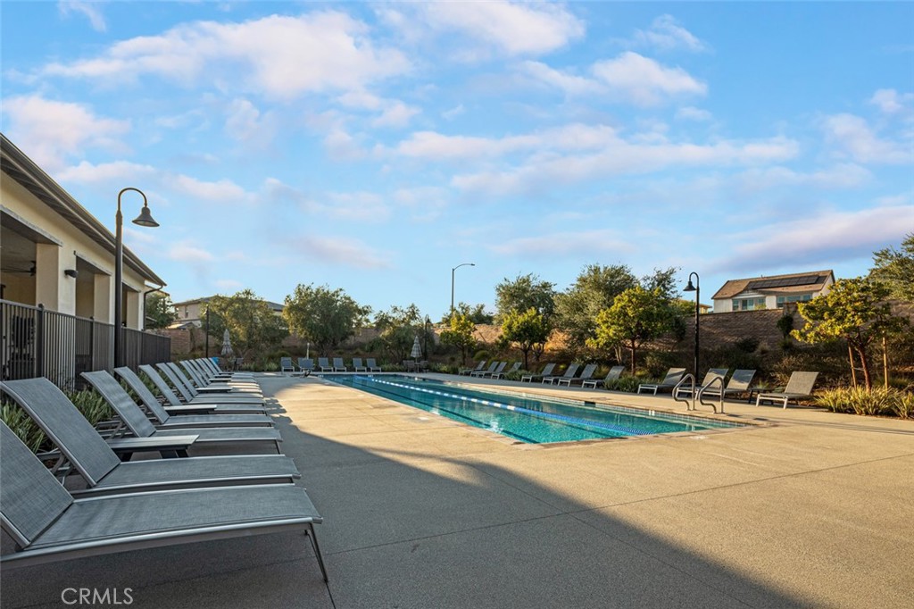 39504 Caladium Drive Temecula, CA 92591 - Photo 33 of 38 a view of a yard with flower plants and wooden fence