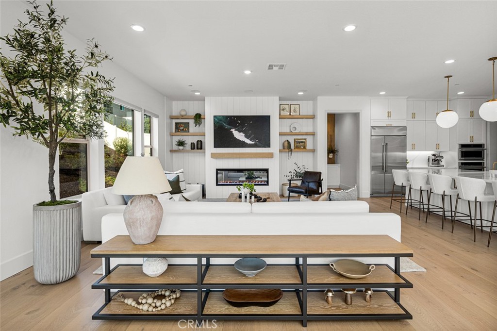 39504 Caladium Drive Temecula, CA 92591 - Photo 8 of 38 a living room with furniture a flat screen tv and a fireplace