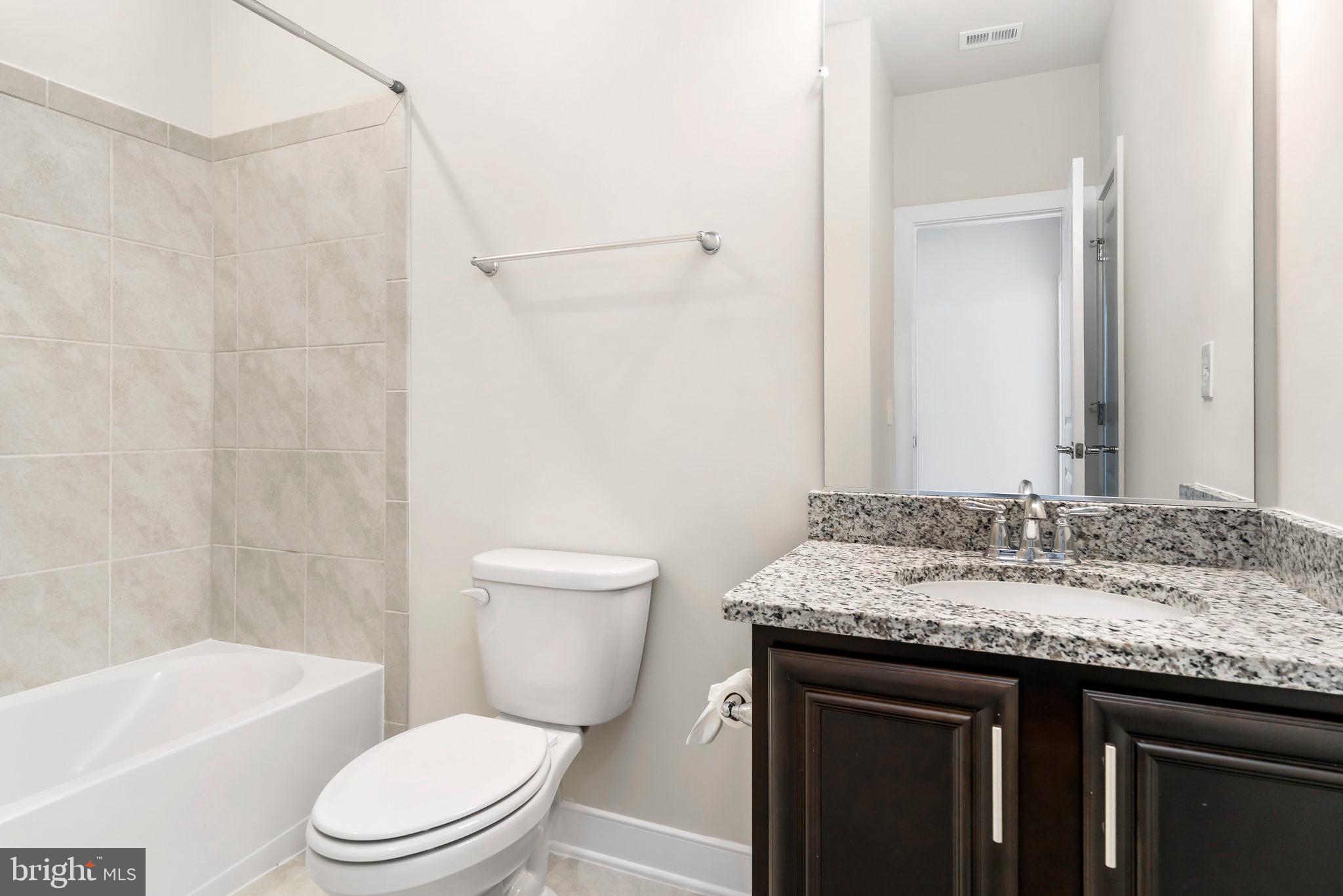 13330 Arrowbrook Centre Drive Herndon, VA 20171 - Photo 13 of 23 2nd full bathroom with granite top, upgraded tile.