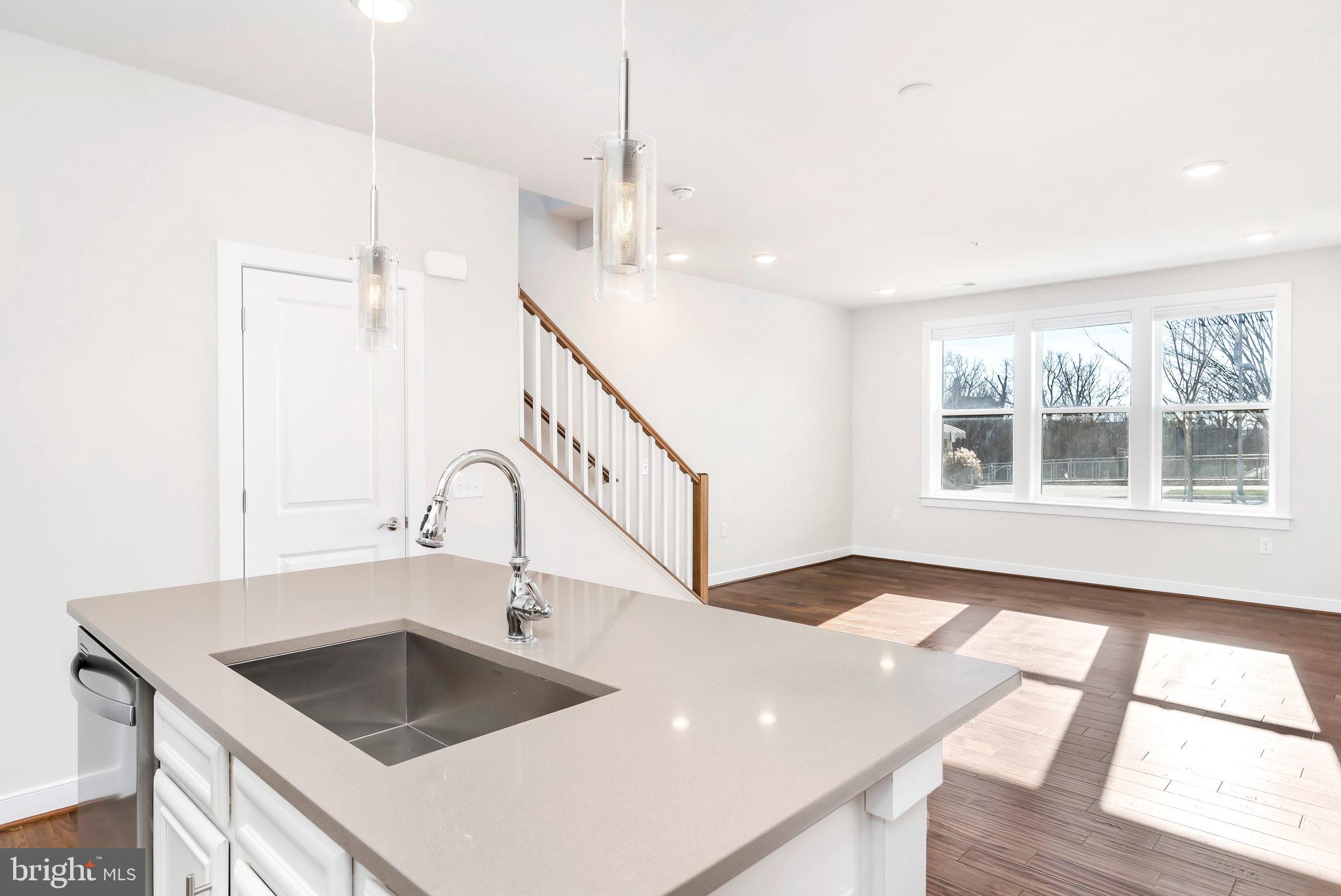 13330 Arrowbrook Centre Drive Herndon, VA 20171 - Photo 6 of 23 Center island with breakfast bar, pendant lights.