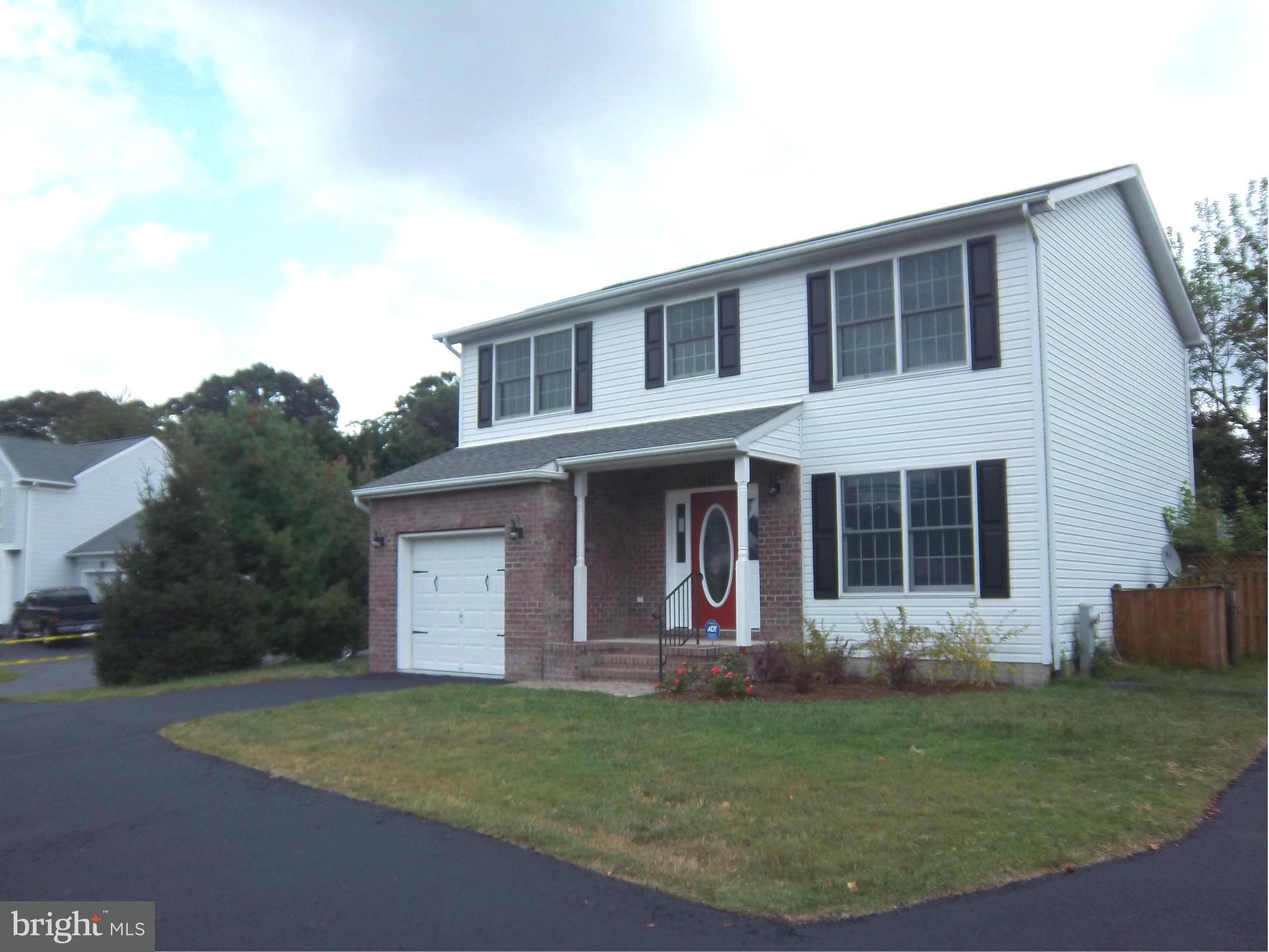 7917 Quarterfield Road Severn, MD 21144 - Photo 2 of 27 front view of a house with a yard