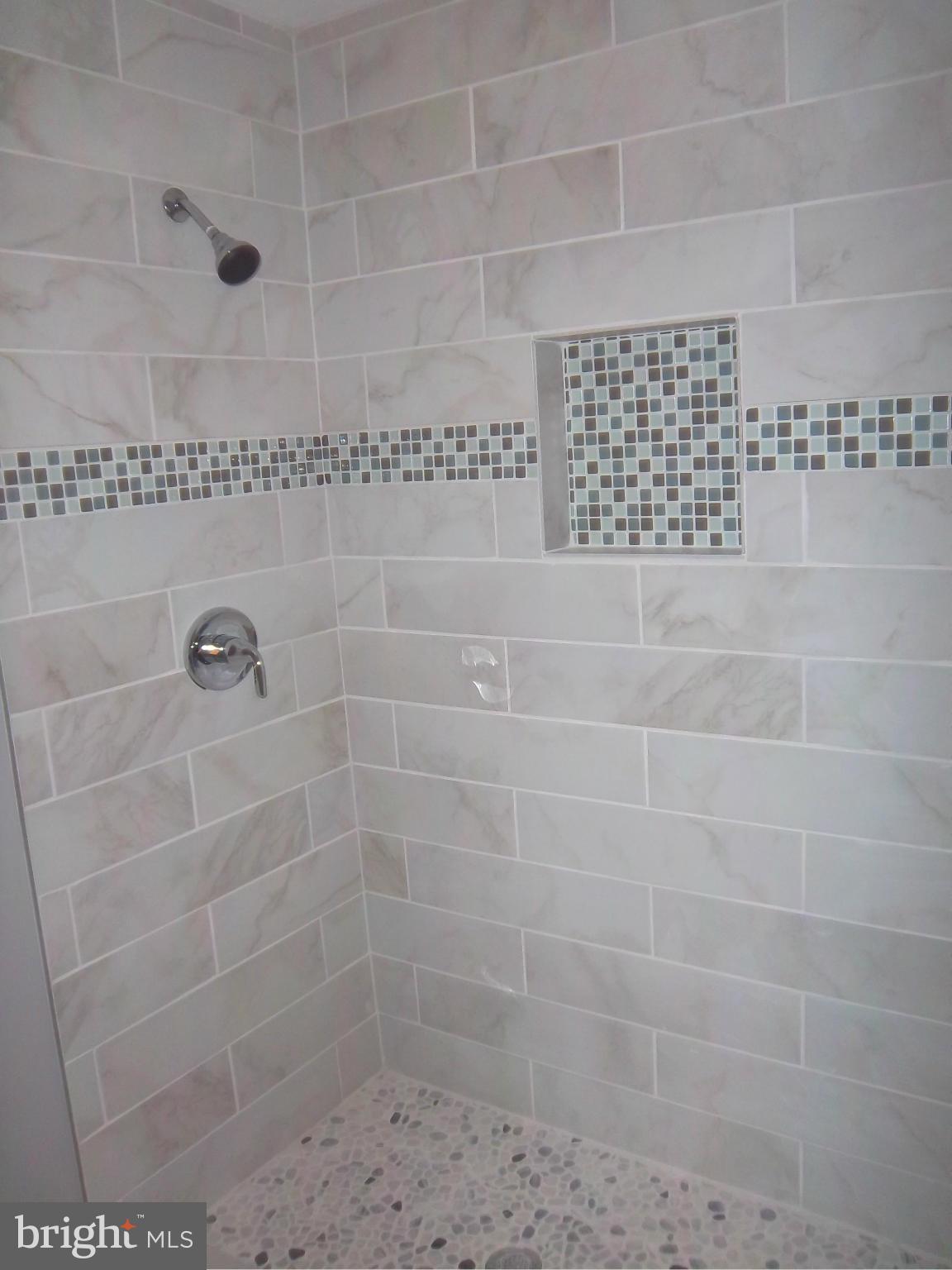 7917 Quarterfield Road Severn, MD 21144 - Photo 11 of 27 a bathroom with a shower