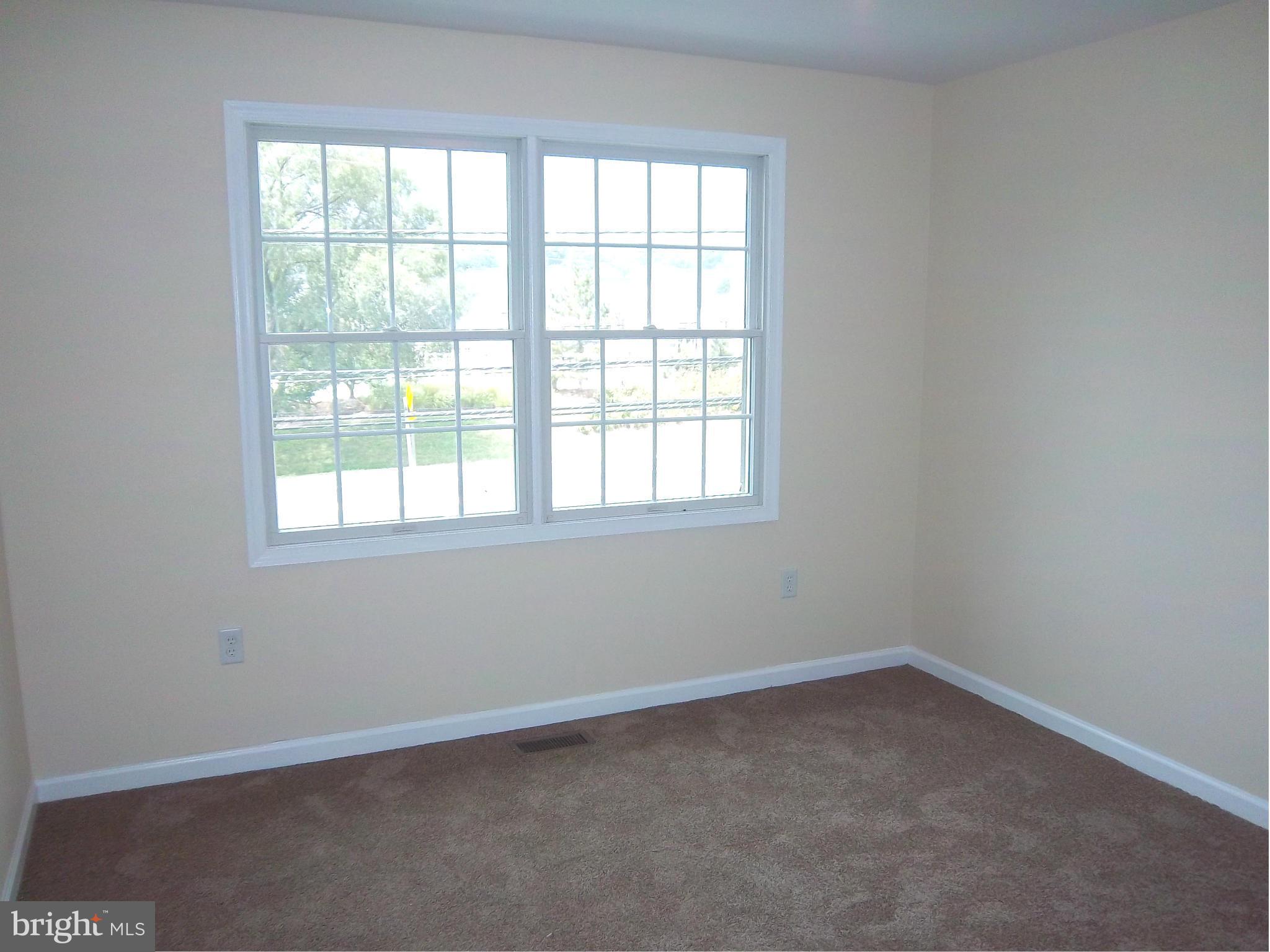 7917 Quarterfield Road Severn, MD 21144 - Photo 19 of 27 an empty room with a window