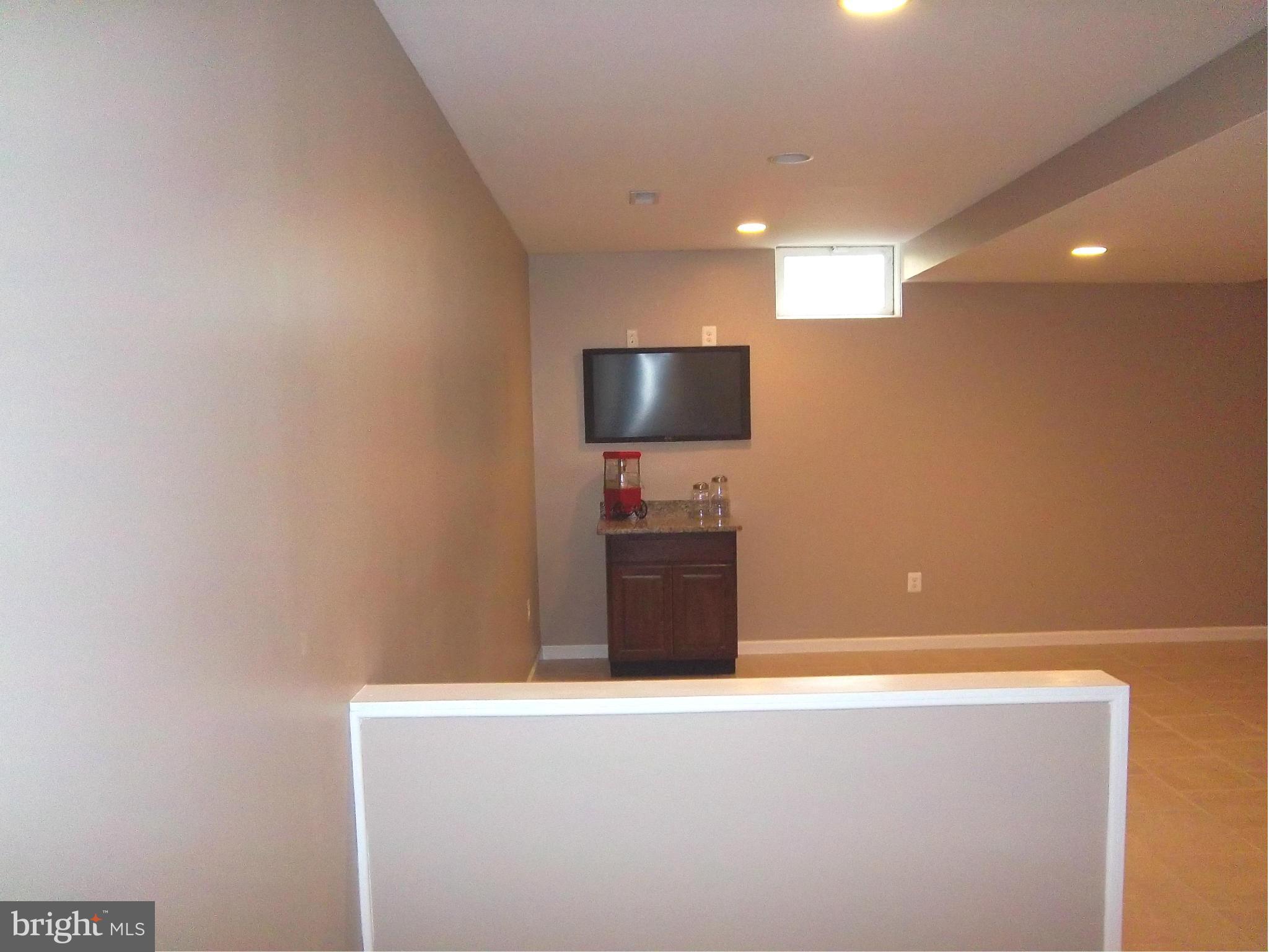 7917 Quarterfield Road Severn, MD 21144 - Photo 24 of 27 a view of kitchen with microwave and sink
