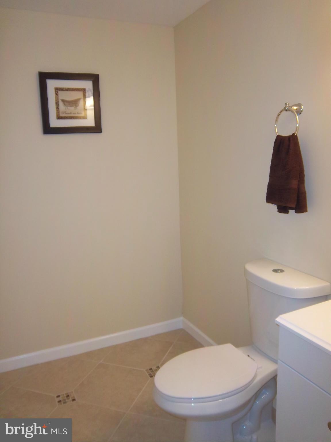 7917 Quarterfield Road Severn, MD 21144 - Photo 25 of 27 a bathroom with a toilet and a shower