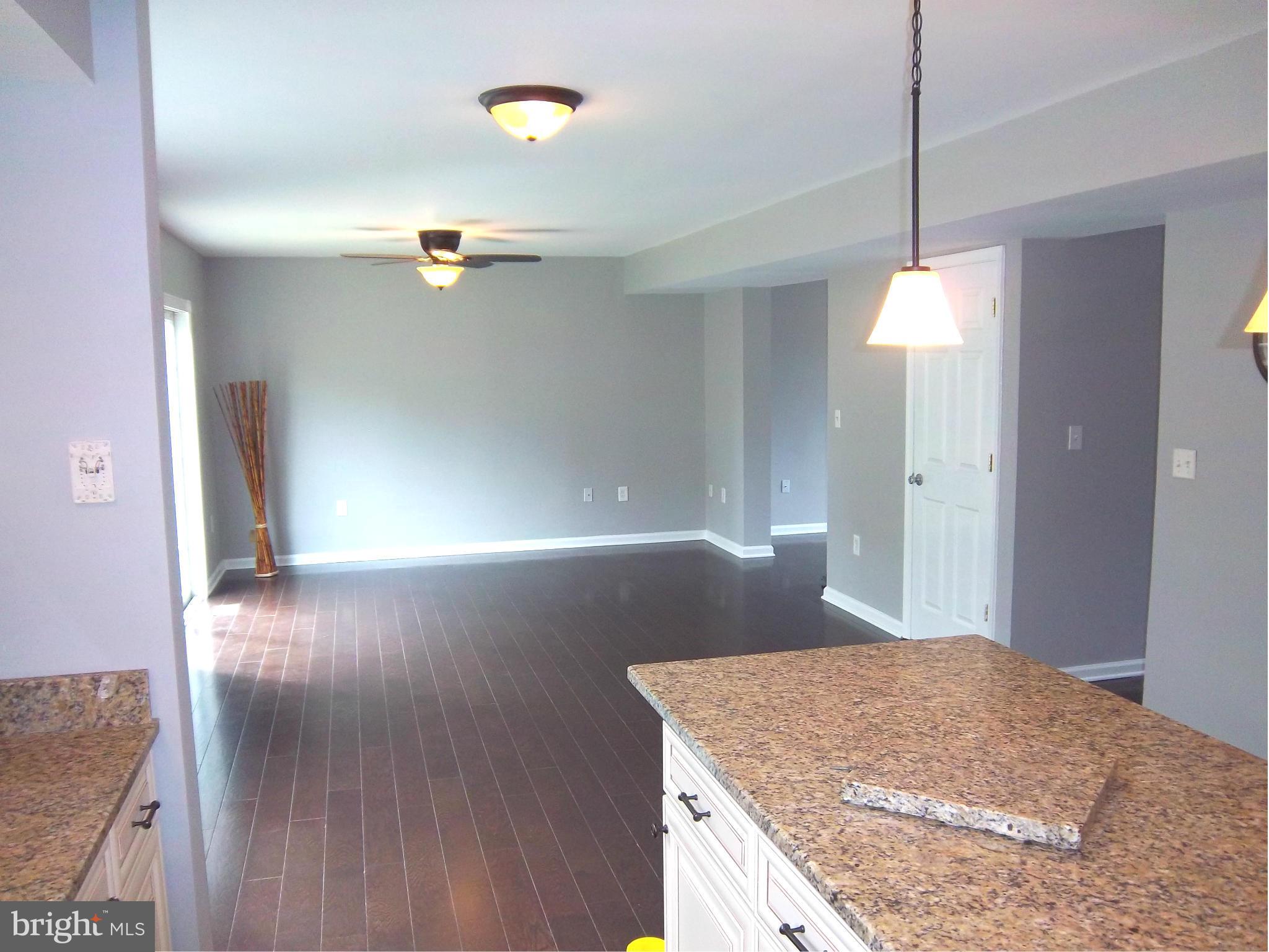 7917 Quarterfield Road Severn, MD 21144 - Photo 5 of 27 a bathroom with a granite countertop sink a vanity and a mirror
