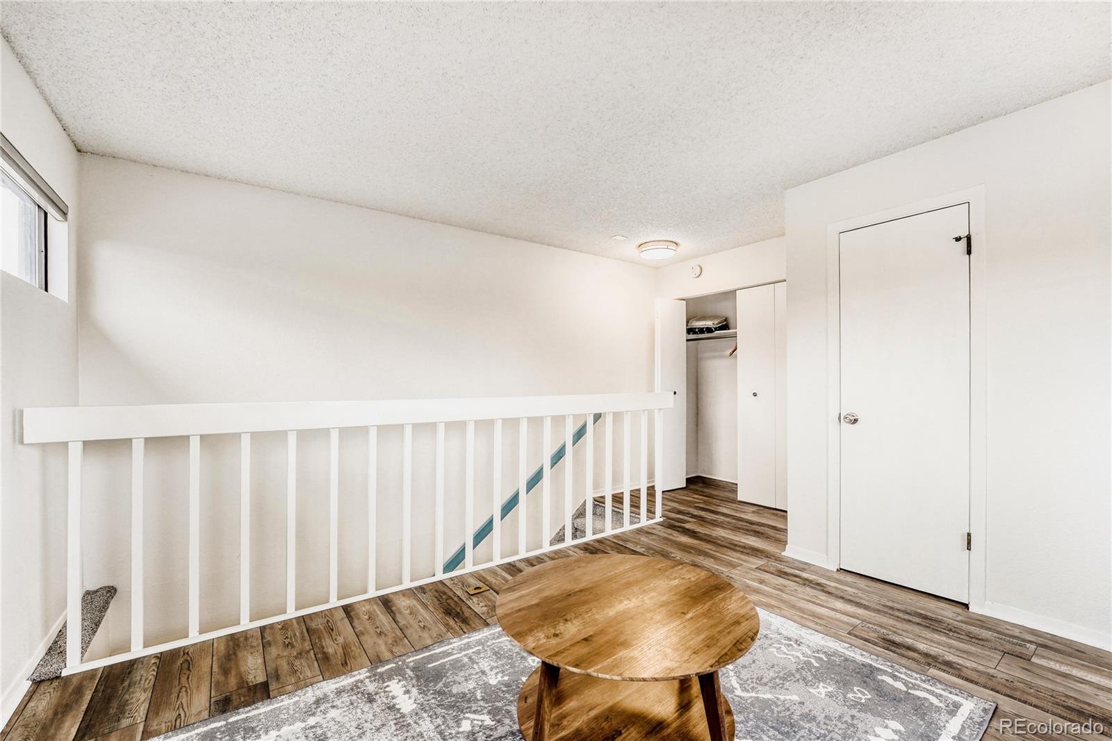 540 South Forest Street, Unit 206 Denver, CO 80246 - Photo 21 of 40 a view of entryway with wooden floor