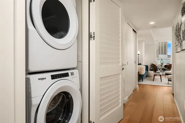 a view of a hallway with washer and dryer