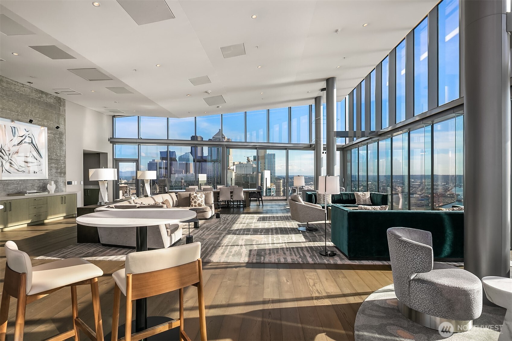 121 Stewart Street, Unit 1304 Seattle, WA 98101 - Photo 15 of 25 a view of kitchen with dining table and chairs