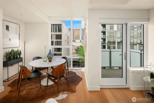 a view of a dining room with furniture window and wooden floor