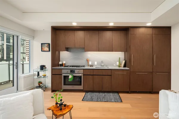 a living room with granite countertop furniture and a fireplace