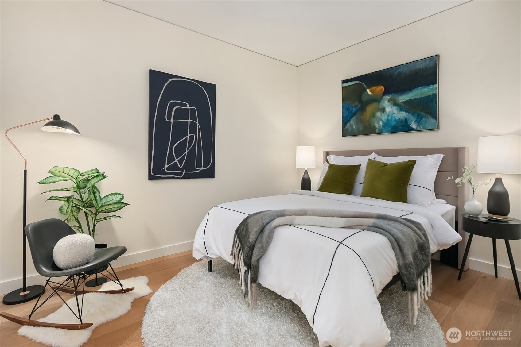 121 Stewart Street, Unit 1304 Seattle, WA 98101 - Photo 10 of 25 a bedroom with bed and chair