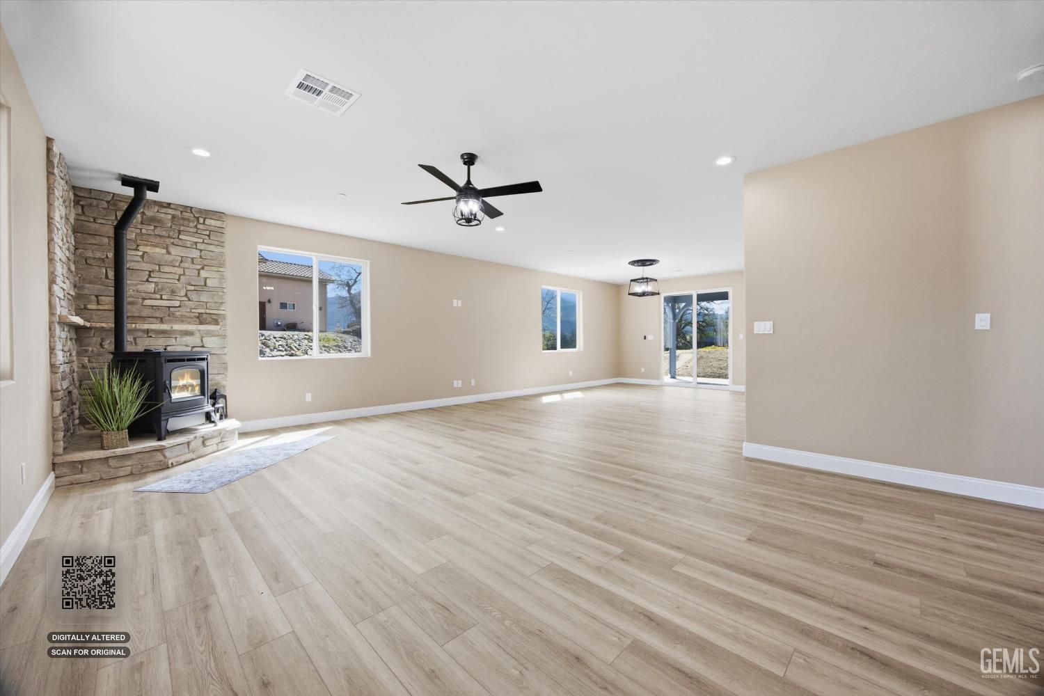 Undisclosed Address Tehachapi, CA 93561 - Photo 14 of 47 a view of a livingroom with wooden floor and a ceiling fan