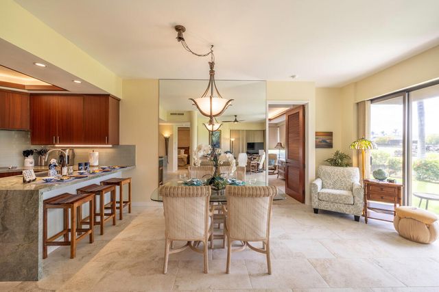 a bedroom with a bed and a table in it