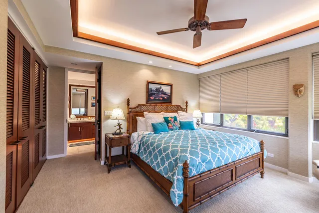 a bedroom with bed and window