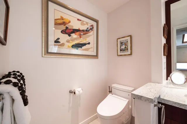 a spacious bathroom with a tub sink and mirror