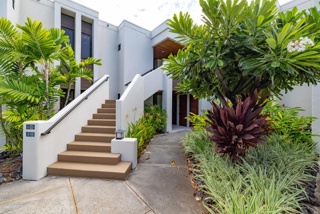 a view of a patio with a yard table and chairs