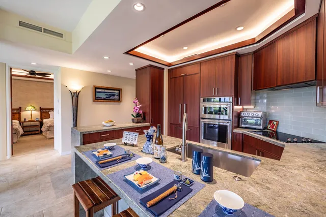 a kitchen with a table chairs stove and refrigerator