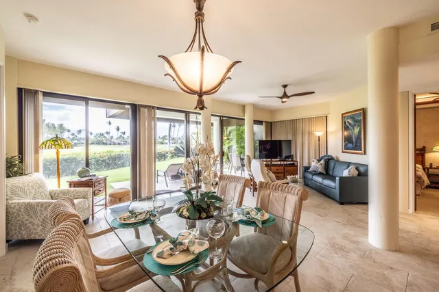 a bathroom with a granite countertop sink a mirror and vanity