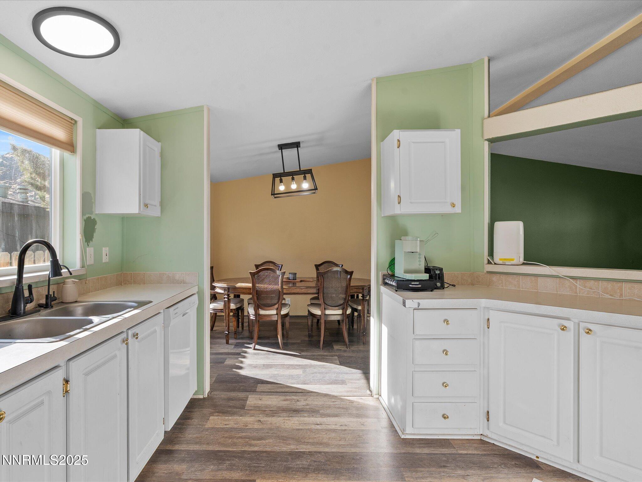 227 Walker Street Gardnerville, NV 89410 - Photo 14 of 33 a kitchen with cabinets a sink and chairs